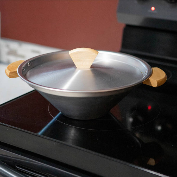 Handcrafted aluminum stovetop popcorn popper with a unique conical shape and natural wood handles and lid knob, featured in Kitchen & Food, Cookware, and Pots and Pans collections.