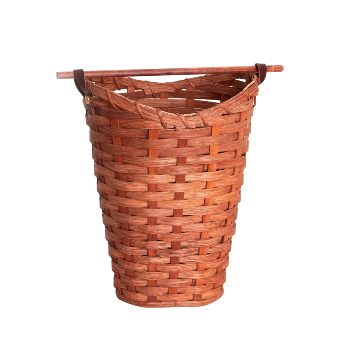 Handwoven maple wood basket with a birch dowel rod for dispensing, designed to hold four standard toilet paper rolls, handcrafted in the USA and featured in Home & Decor and Amish Made collections.