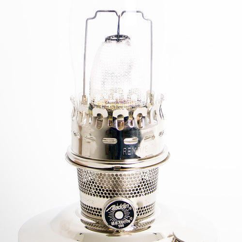 Close-up of a polished chrome-plated oil lamp burner with glass chimney, featuring a vintage-inspired design and handcrafted details, perfect for Farm, Garden & Tool and Lamps & Lighting collections.