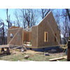 Partially constructed tiny house with plywood sheathing and framed openings, supported by timber braces, set outdoors among leafless trees, featured in Toys, Books & Games and Home and Garden How-To Books collections.