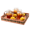 Handcrafted serving tray with woven sides and flat wooden base, featuring two side handles, holding three glass mugs of iced tea and four fresh lemons for serving in Kitchen & Food and Storage collections.