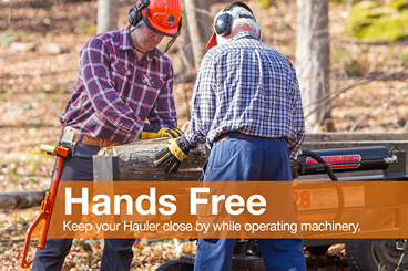 Two men outdoors using wood cutting equipment, one wearing a leather holster designed for hands-free convenience in wood hauling, featured in Farm, Garden & Tool and USA Made collections.