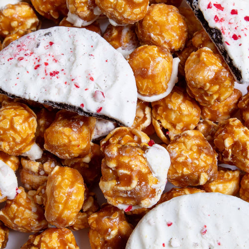 Close-up of handcrafted caramel popcorn mixed with peppermint bark pieces and crushed candy, featured in Kitchen & Food, Food, Snacks and Sweets, Popcorn, Best Sellers, and Promo Eligible collections.
