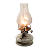 Handcrafted clear glass oil lamp with a lit flame inside a chimney, featuring a decorative base and metal burner, ideal for farm, garden, emergency lighting, and best-selling collections.