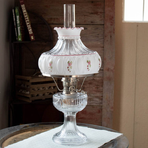 Vintage-style clear glass oil lamp with ornate metal burner and handcrafted amethyst rose glass shade featuring delicate floral designs, ideal for Lamps & Lighting, Parts and Accessories, Lamp Shades, and Best Sellers collections.