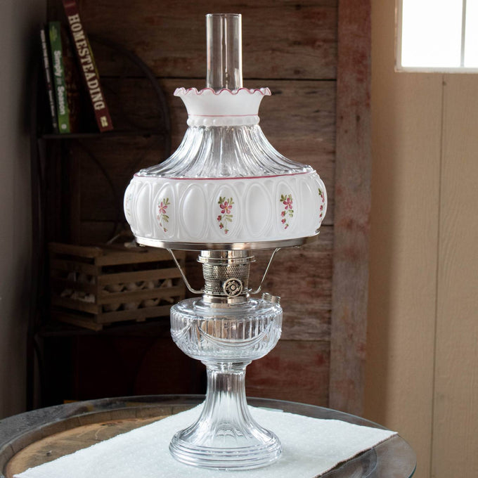 Vintage-style clear glass oil lamp with ornate metal burner and handcrafted amethyst rose glass shade featuring delicate floral designs, ideal for Lamps & Lighting, Parts and Accessories, Lamp Shades, and Best Sellers collections.