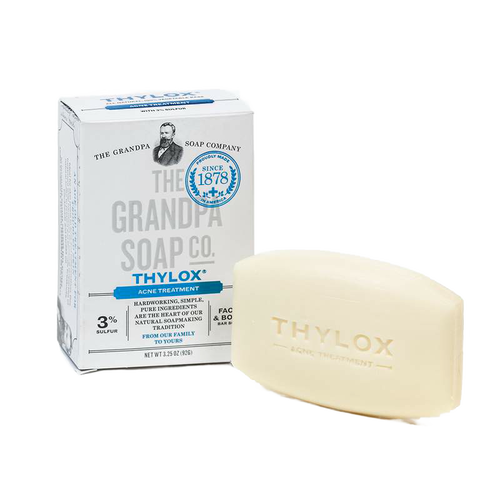 Bar of Grandpa's Thylox acne treatment soap with 3% sulfur content beside its white and blue box, handcrafted and made in USA, featured in Health & Wellness and Grooming collections.