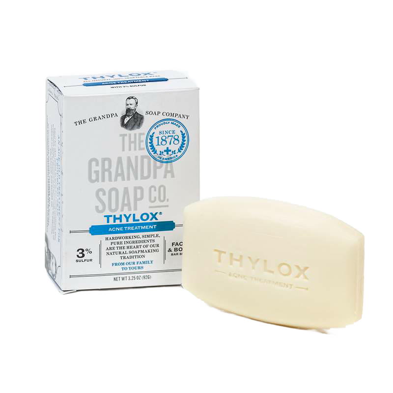 Bar of Grandpa's Thylox acne treatment soap with 3% sulfur content beside its white and blue box, handcrafted and made in USA, featured in Health & Wellness and Grooming collections.