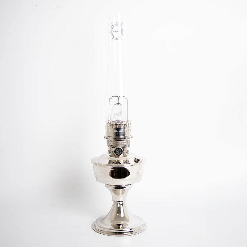Bright handcrafted chrome-plated oil lamp with tall glass chimney, designed for lamps & lighting, oil lamps, and table lamps collections, featuring a classic elegant style.