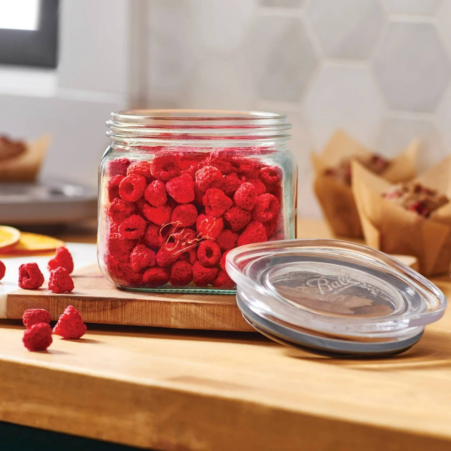 Stackable clear glass storage jar with airtight silicone-sealed lid filled with dried raspberries, displayed on a wooden countertop in a modern kitchen, ideal for Home & Decor and Kitchen & Food collections.