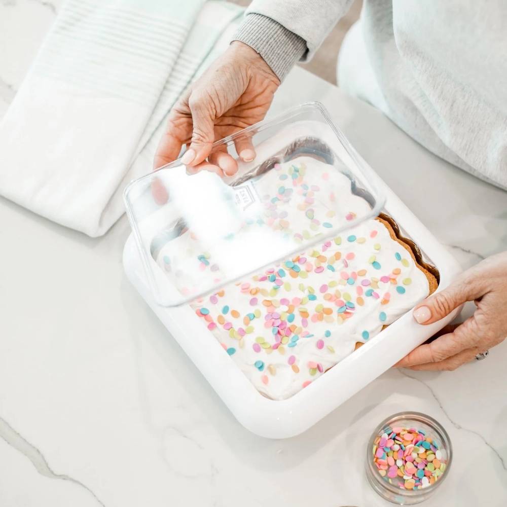 Handcrafted clear travel cover with removable window protecting an 8x8 foil pan filled with a decorated sheet cake, featured in Kitchen & Food, USA Made, and Kitchen Accessories collections.