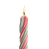 Handmade red and green spiral candle burning with a steady flame, showcasing dripless design ideal for holiday decor in home, lamps & lighting, and festive settings.