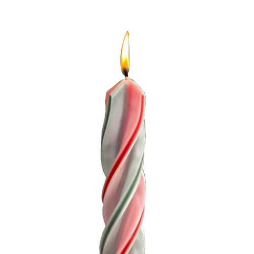 Handmade red and green spiral candle burning with a steady flame, showcasing dripless design ideal for holiday decor in home, lamps & lighting, and festive settings.