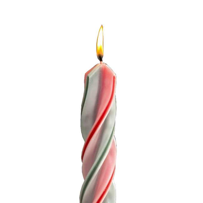 Handmade red and green spiral candle burning with a steady flame, showcasing dripless design ideal for holiday decor in home, lamps & lighting, and festive settings.