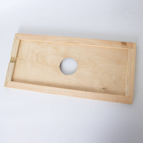 Handmade Amish crafted wooden hive inner cover with a 2-3/4 inch center ventilation hole, designed for moisture control and airflow, part of USA made beekeeping supplies.