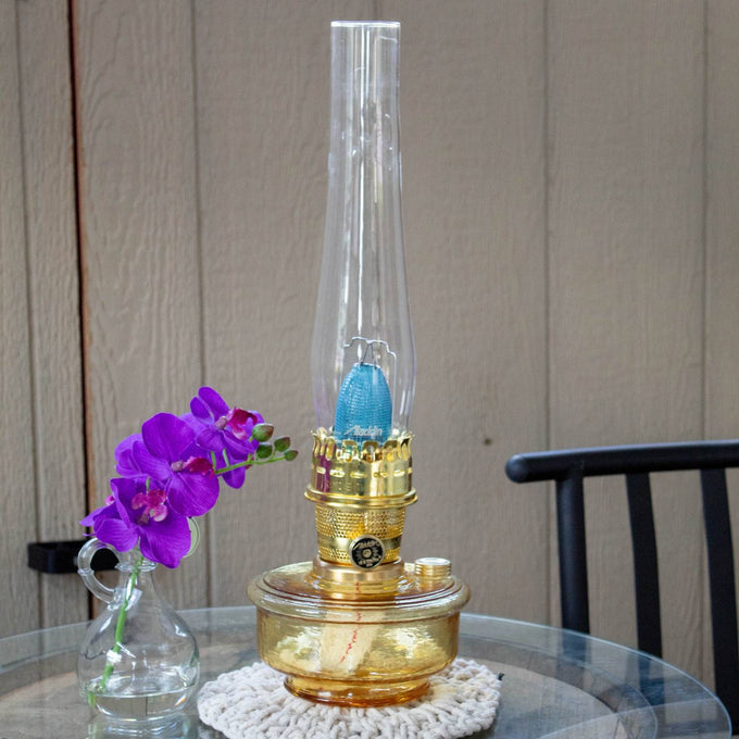 Handcrafted amber glass oil lamp with clear tall chimney and brass burner, designed for Farm, Garden & Tool, Lamps & Lighting, Emergency Supplies, Oil Lamps, Wall Lamps, and Best Sellers collections.