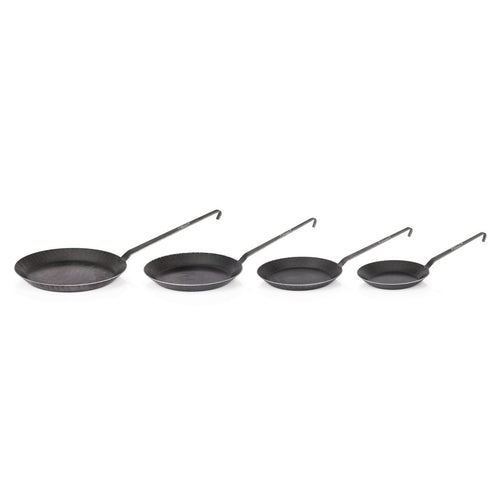 Set of four handcrafted wrought iron pans with long handles, designed for versatile cooking indoors or outdoors, ideal for Farm, Garden & Tool, Kitchen & Food, Camping, Cookware, Pots and Pans, Best Sellers, and Promo Eligible collections.