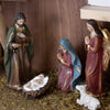 Handcrafted resin nativity figurines in a moss-covered stable featuring Joseph, Mary, an angel, baby Jesus in a manger, and a lamb, crafted for Home & Decor, Holiday Decor, Best Sellers, Promo Eligible collections.