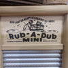 Close-up of handcrafted wooden framed mini tin spiral washboard with decorative printed front featuring vintage-style laundry illustration, part of Home & Decor and Laundry Supplies collections.