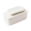 Simple white ceramic butter keeper with rectangular shape and fitted lid, designed for storing full sticks of butter using an airtight water seal, part of Kitchen & Food collections.