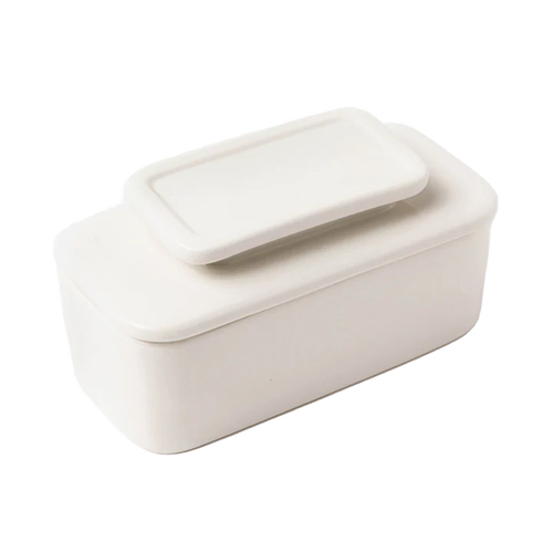 Simple white ceramic butter keeper with rectangular shape and fitted lid, designed for storing full sticks of butter using an airtight water seal, part of Kitchen & Food collections.