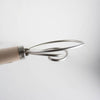 Close-up of a handcrafted Amish made dough whisk with two spiral stainless steel wires and a smooth wooden handle, ideal for baking and kitchen gadgets collections.