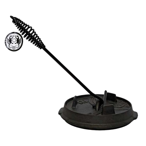 Cast iron Dutch oven lid being lifted by a black metal lid lifter with a coiled handle, designed for safe and comfortable use, featured in Farm, Garden & Tool, Camping, Best Sellers, and Promo Eligible collections.