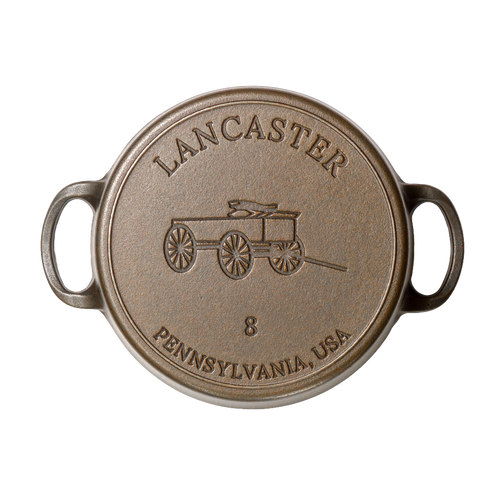 Top view of a handcrafted, Amish-made cast iron Dutch oven lid featuring a vintage wagon design and size 8 marking, made in USA, ideal for Kitchen & Food and Cast Iron collections.