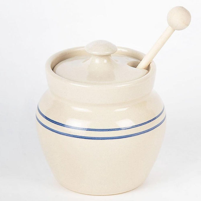 Handcrafted stoneware honey pot in rustic stone color with classic blue stripes and a wooden dipper, part of Kitchen & Food, Storage and Serving, USA Made, and Best Sellers collections.