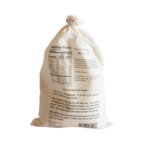 Natural cotton drawstring bag holding handcrafted onion-caraway beer bread mix with detailed nutrition facts and baking instructions, ideal for Kitchen & Food, Pantry, Dry Goods and Mixes, Best Sellers, and Promo Eligible collections.