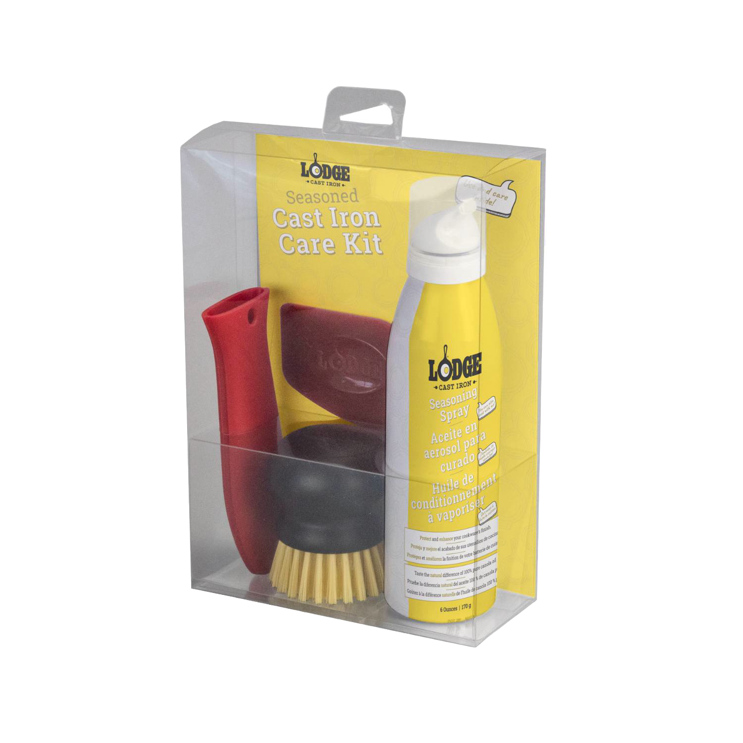 Clear packaging containing a cast iron care kit with a yellow seasoning spray bottle, a red silicone handle holder, a nylon scrub brush, and a pan scraper, featured in Kitchen & Food and Cast Iron collections.