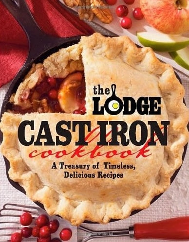 Close-up of a rustic homemade fruit pie baked in a cast iron skillet, highlighting the golden crust and fresh ingredients, perfect for cookbooks in Books and Cookbooks collections.