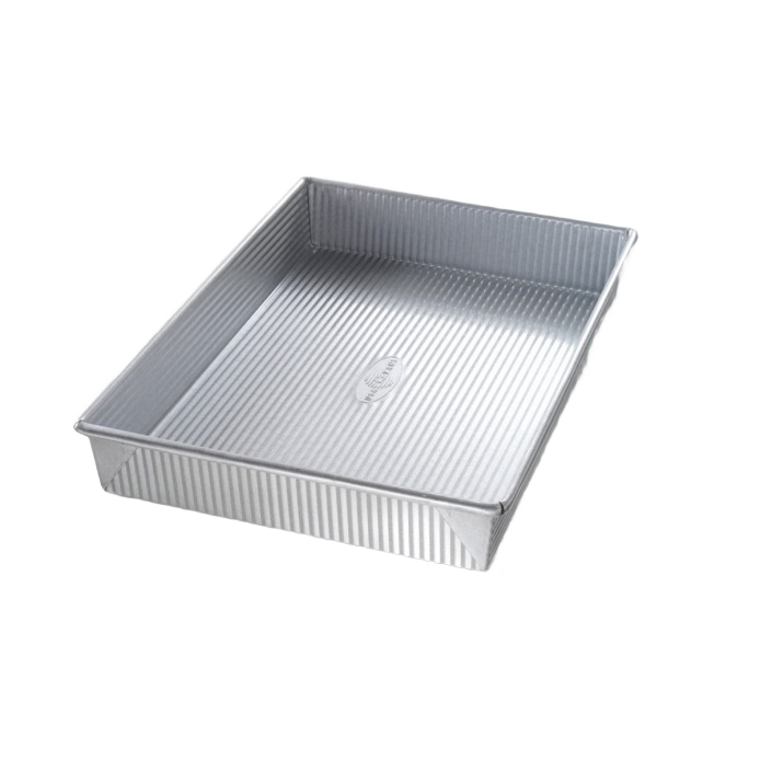 Durable aluminized steel rectangular baking pan with seamless construction for even cooking, designed in USA, ideal for kitchens, baking supplies, cookware, and pots and pans collections.