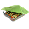 Translucent green reusable silicone bowl cover with banana leaf design sealing a glass dish filled with layered sliced vegetables, ideal for Kitchen & Food, Storage and Serving collections.