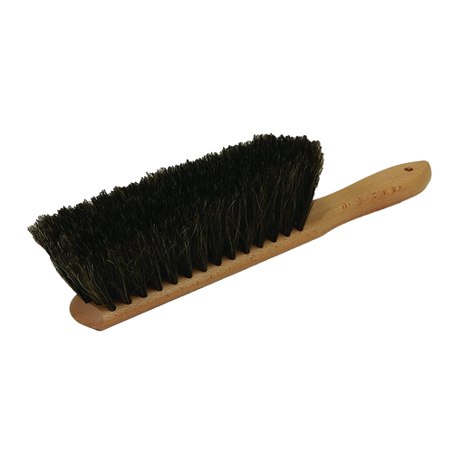 Hand brush with dense natural horsehair bristles and a smooth wooden handle featuring a hanging hole, designed for efficient sawdust removal in farm, garden, and tool care.
