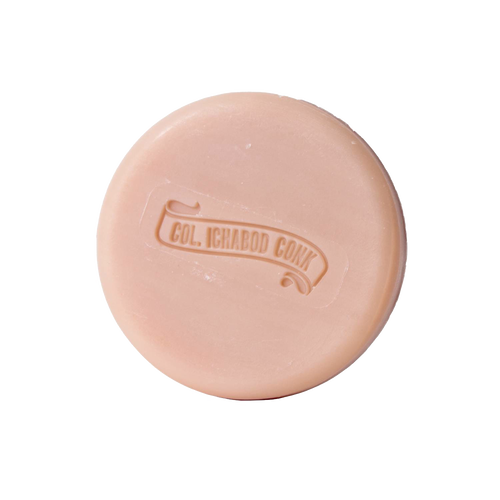 Round almond-scented shaving soap bar with embossed logo, crafted with moisturizing ingredients, featured in Health & Wellness, Grooming and Personal Hygiene, USA Made, and Best Sellers collections.