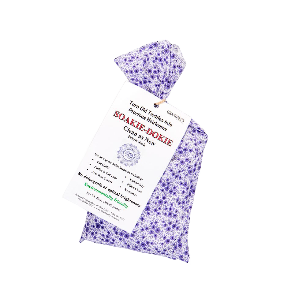 Lavender-patterned fabric sachet of Soakie-Dokie fabric soak with printed label highlighting gentle, detergent-free formula, made in USA, ideal for Home & Decor and Laundry Supplies collections.