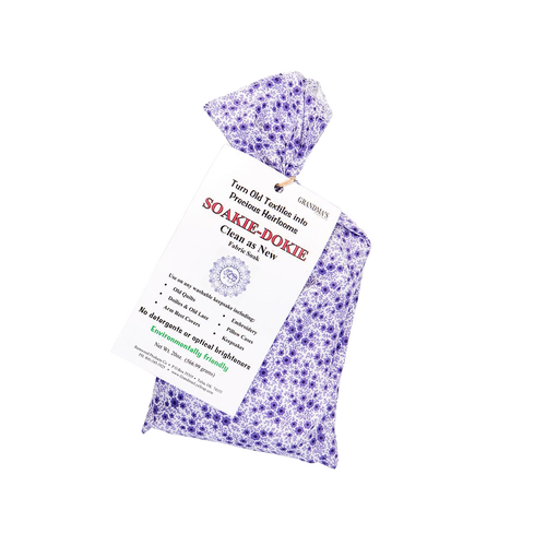 Lavender-patterned fabric sachet of Soakie-Dokie fabric soak with printed label highlighting gentle, detergent-free formula, made in USA, ideal for Home & Decor and Laundry Supplies collections.