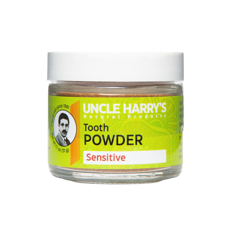 Small clear jar of handcrafted tooth powder for sensitive teeth with bright green label, promoting gentle oral care in Health & Wellness and USA Made collections.