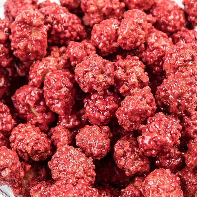 Close-up of crunchy candy-coated peanuts with a classic red coating, showcasing a handcrafted treat popular in USA Made, Candy, and Best Sellers collections.