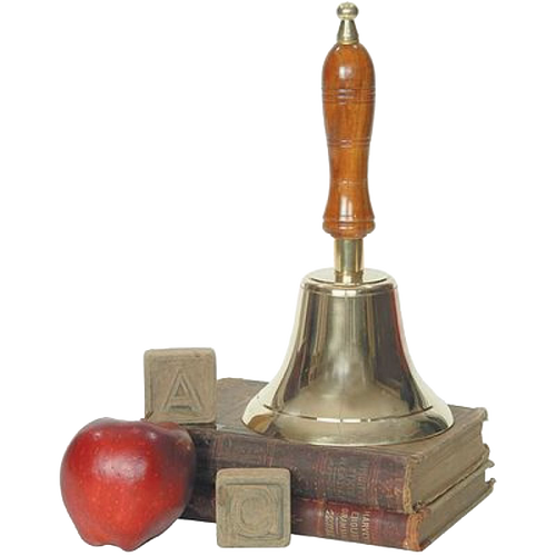 Shiny brass bell with a long wooden handle, displayed atop vintage books alongside a red apple and wooden alphabet blocks, representing classic home and decor style.