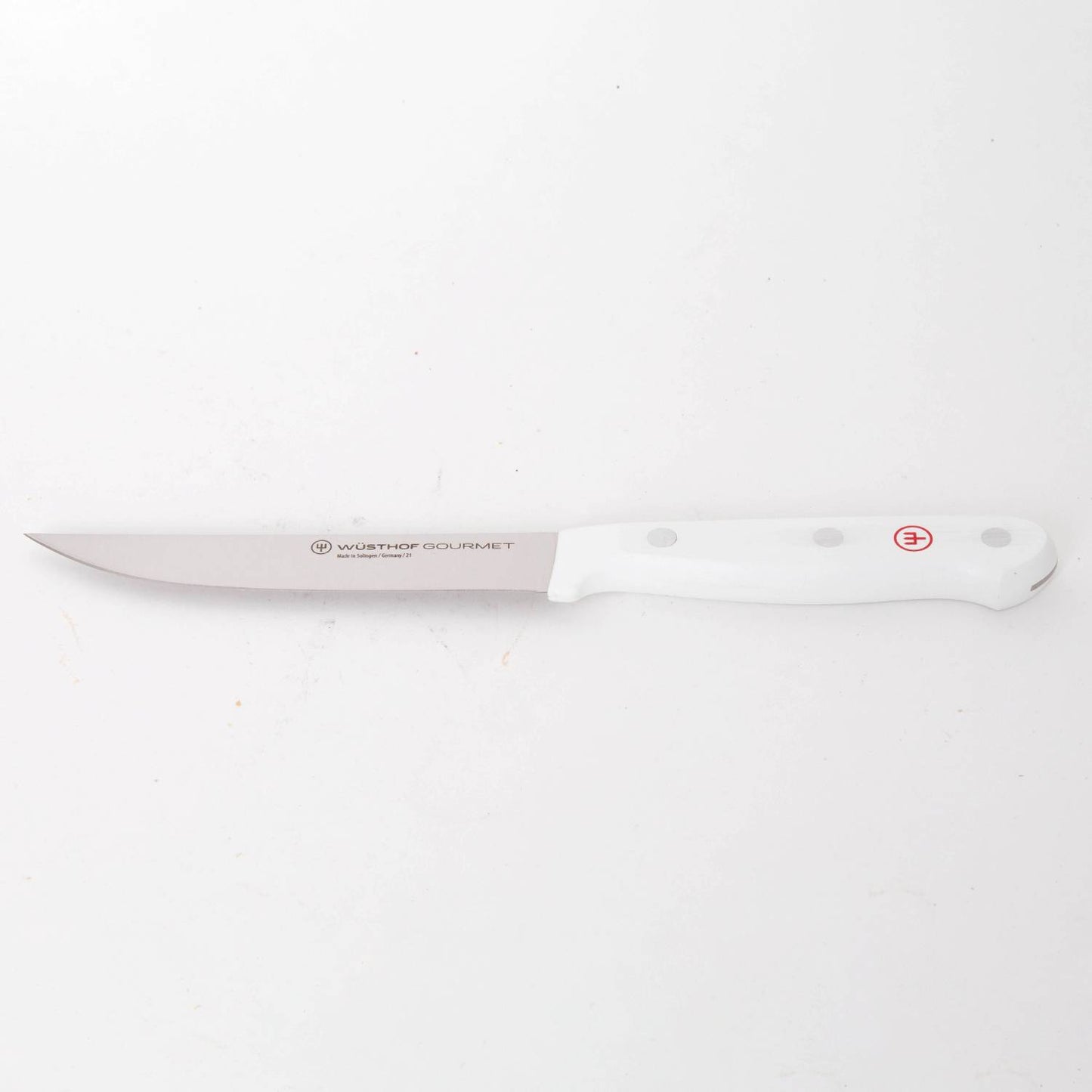 Slim stainless steel slicing knife with a pointed blade and smooth white handle featuring rivets, designed for precise food prep in Farm, Garden & Tool and Kitchen & Food collections.