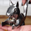 Handcrafted cast aluminum squirrel nutcracker lifting its tail to crack nuts, shown in use on hand with nut shells, featured in Kitchen & Food, Food Prep, Choppers and Cutters, Best Sellers collections.