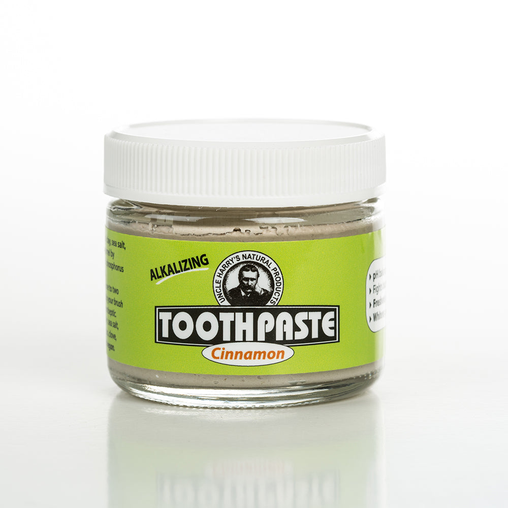 Handcrafted small glass jar of cinnamon-flavored alkalizing toothpaste with a white lid and bright green label, featured in Health & Wellness, Grooming and Personal Hygiene, USA Made, and Best Sellers collections.