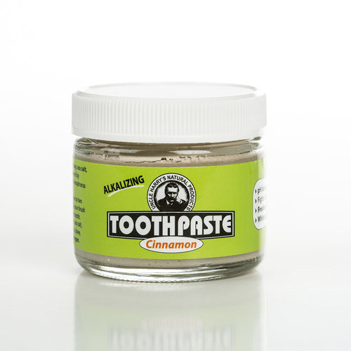 Handcrafted small glass jar of cinnamon-flavored alkalizing toothpaste with a white lid and bright green label, featured in Health & Wellness, Grooming and Personal Hygiene, USA Made, and Best Sellers collections.