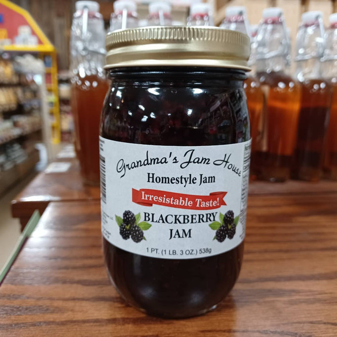 Handcrafted jar of blackberry homestyle jam with a gold metal lid and white label featuring fruit illustrations and "Irresistable Taste" banner, made in USA, perfect for Kitchen & Food, Pantry, Peanut Butter & Jellies, Best Sellers, and Promo Eligible collections.