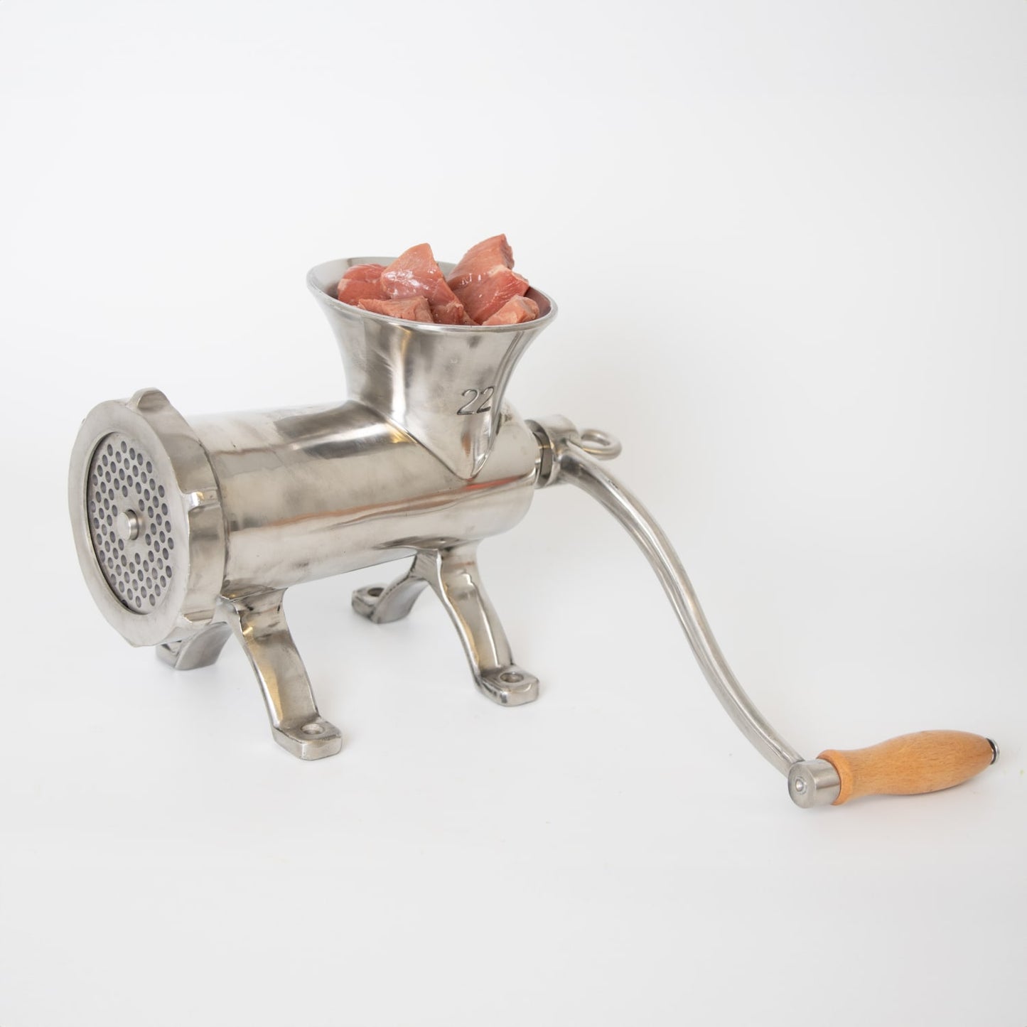 Handcrafted stainless steel mounted meat grinder with wooden handle and chunks of fresh meat loaded in hopper, designed for secure attachment in Kitchen & Food, Specialty Equipment, Butchering Supplies, Best Sellers, and Promo Eligible collections.