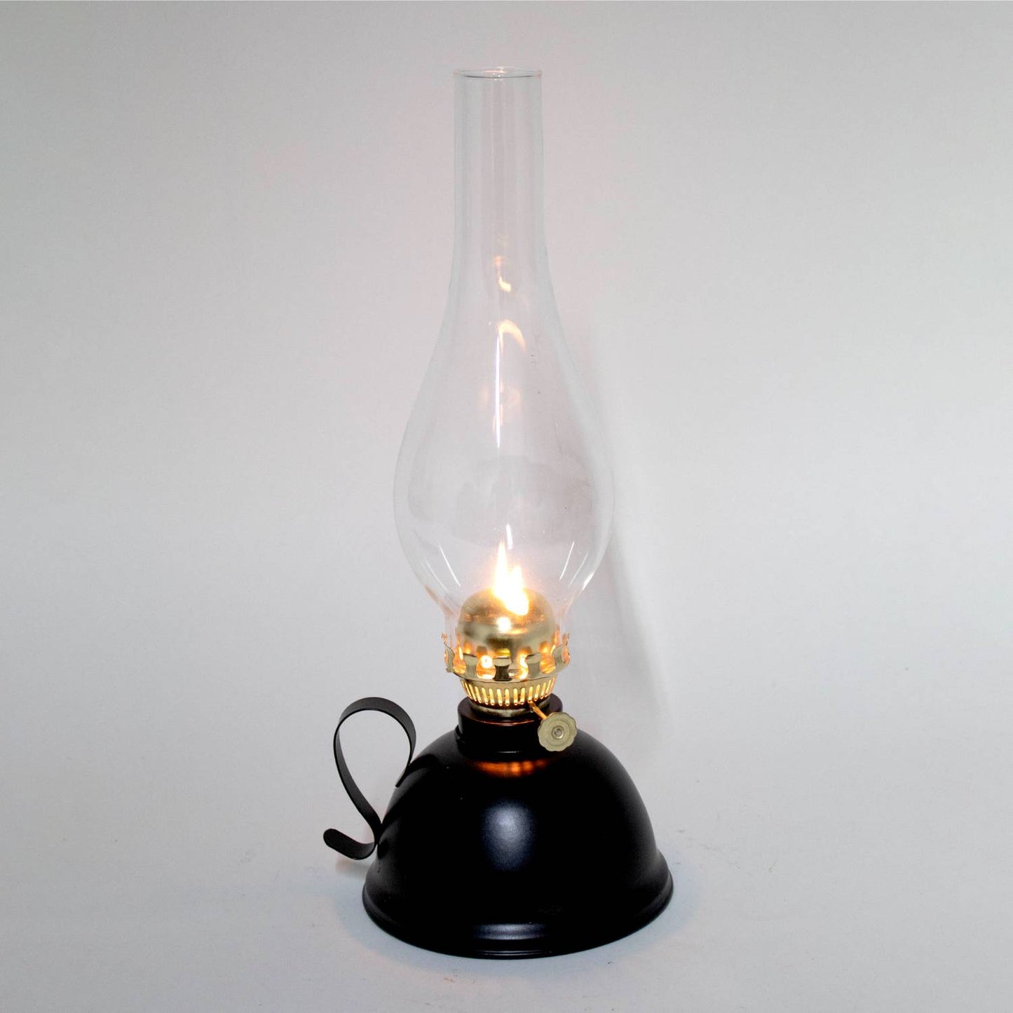 Handcrafted vintage-style oil lamp with a black steel round font, curved handle, and clear glass chimney, designed for reliable lighting in Farm, Garden & Tool, Emergency Supplies, and Best Sellers collections.