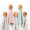 Set of oak towel holders with protective clear finish, each featuring a unique rustic design and adhesive backing, supporting USA made, Amish made, Home & Decor, and Household Helpers collections.