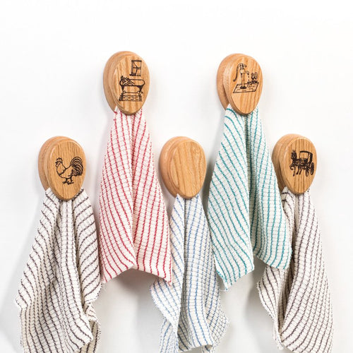 Set of oak towel holders with protective clear finish, each featuring a unique rustic design and adhesive backing, supporting USA made, Amish made, Home & Decor, and Household Helpers collections.